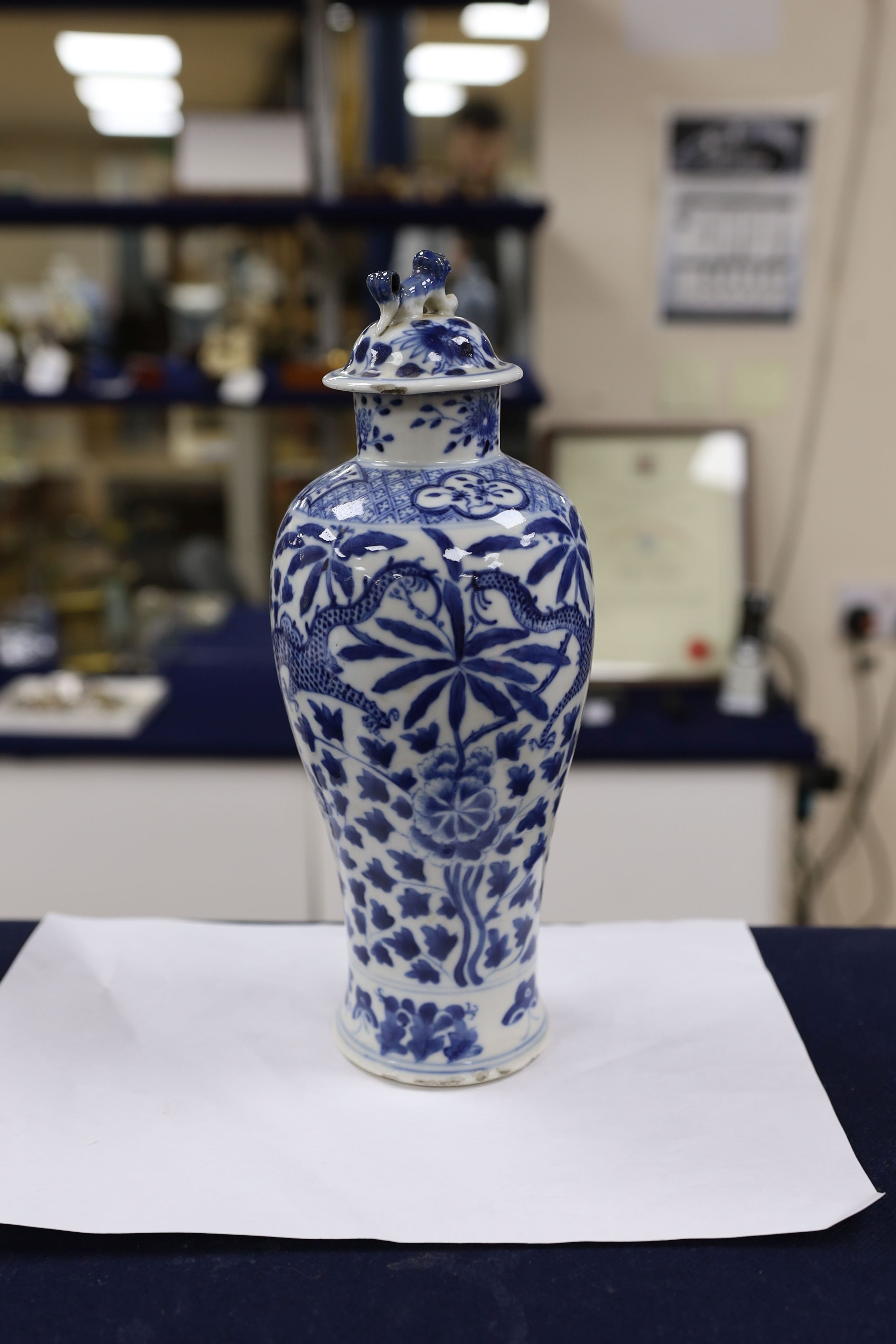 A pair of Chinese blue and white dragon vases and covers, circa 1900. 28cm